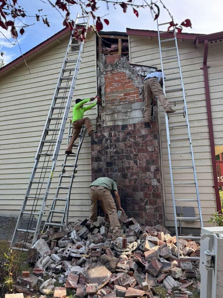 Chimney4u crew taking down a chimney to sound masonry before a rebuild