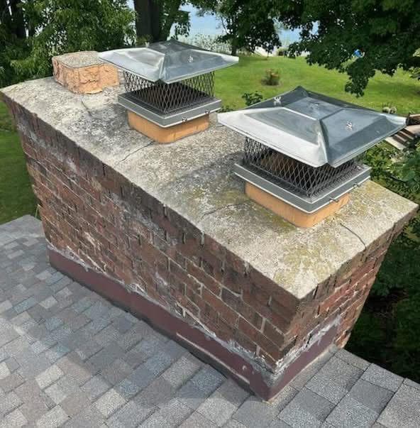 Double-flue chimney with a cracked, weathered crown